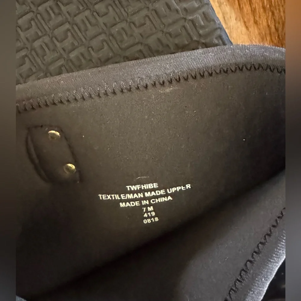 Tommy Hilfiger Black Boots. Gold accent hardware, logo embossed fabric.